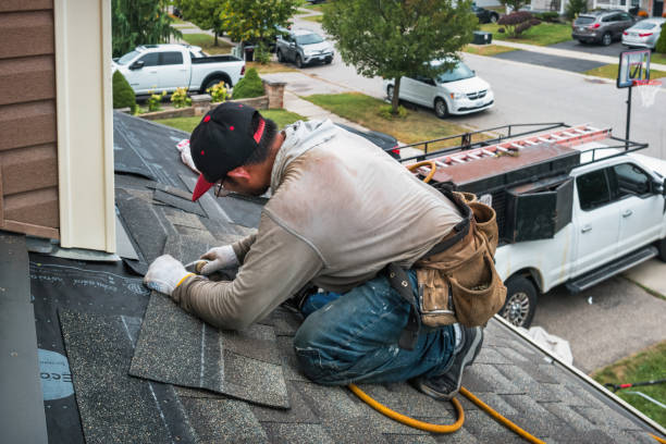 Professional Roof Replacement technician working in Lingle, WY